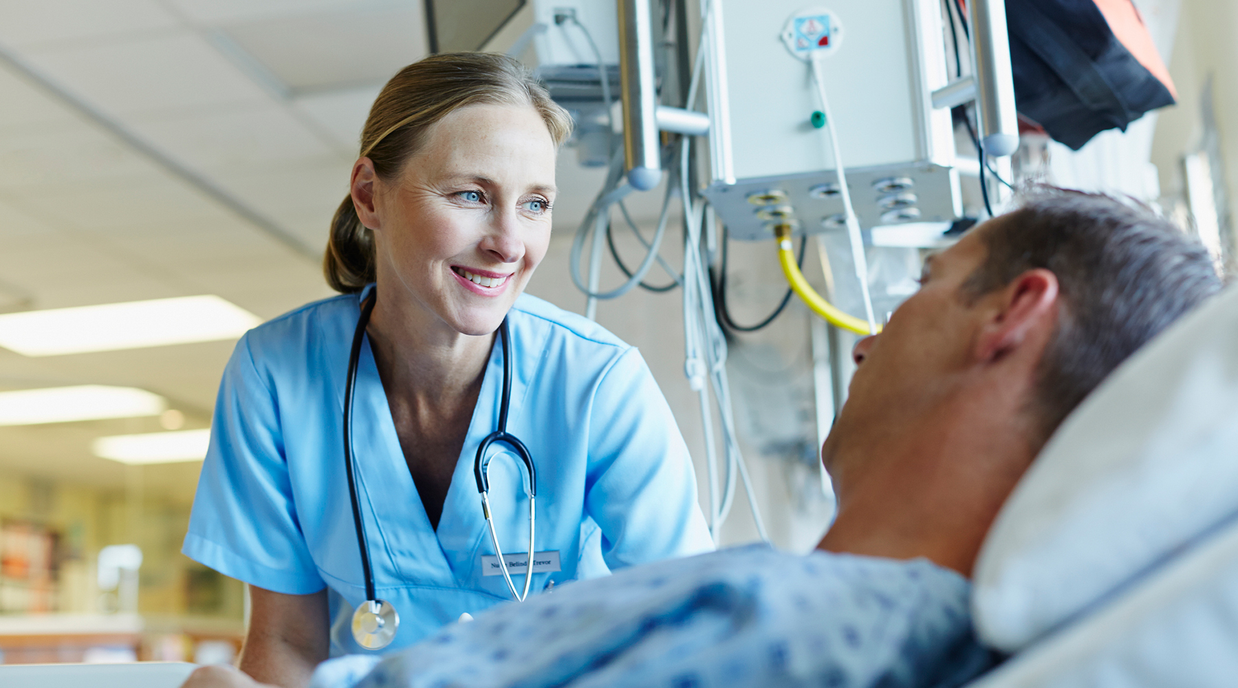 Nurse talking to hospital patient